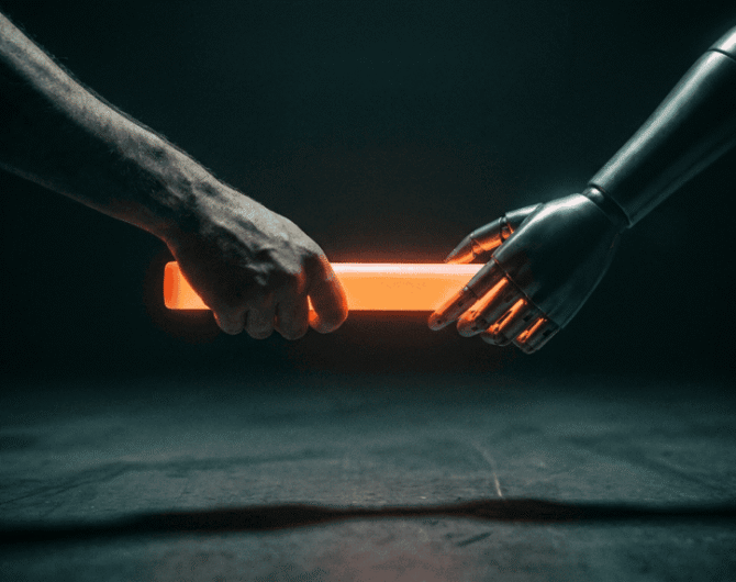 Human hand and robotic hand holding a glowing orange light stick.
