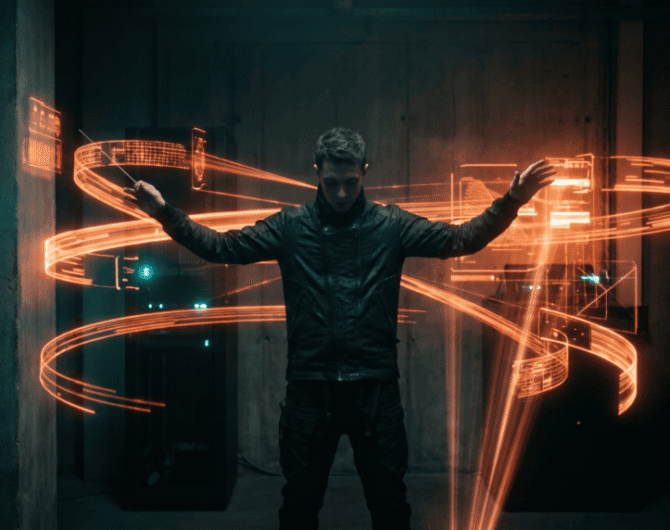 Futuristic man with glowing orange light trails in a dark room.