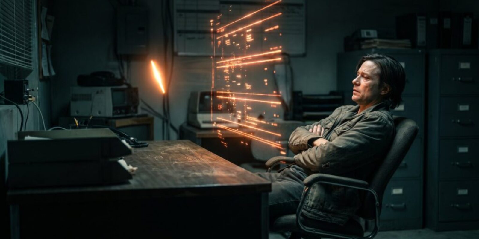 Person working with advanced AI technology and sparks flying in a dark office.